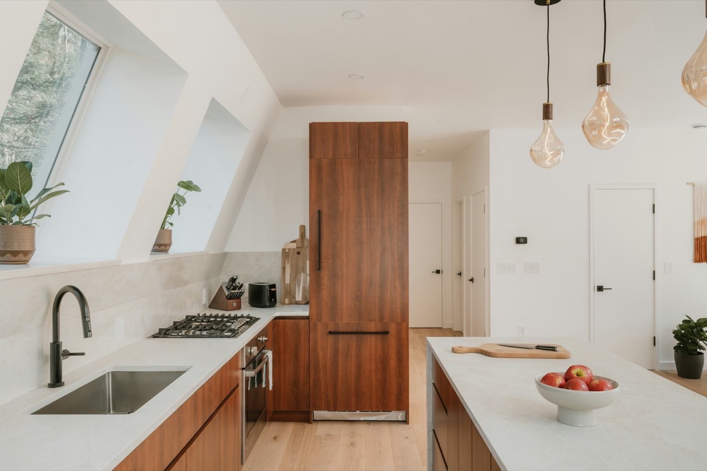Secondary kitchen with warm wood cabinetry