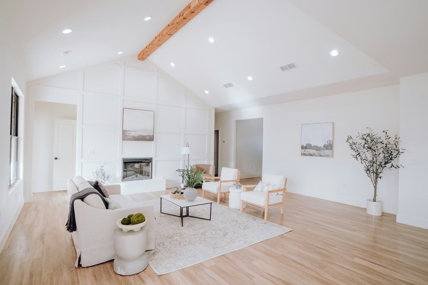 Sitting room with white furniture and pale oak floors